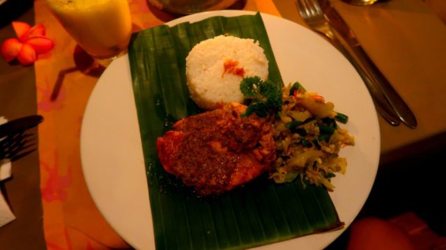 Delicious dinner - fish, rice and vegetables served on a banana leaf in a restaurant in Ubud - central Bali indonesia 