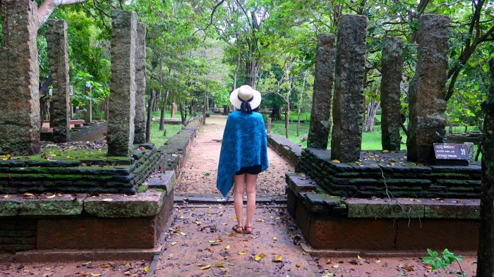 A girl exploring the ruins of the ancient city of Anuradhapura in Sri Lanka 