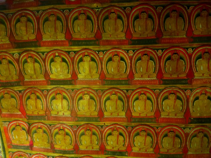 paintings of buddha on the ceiling inside of Dambulla golden cave temple in sri lanka