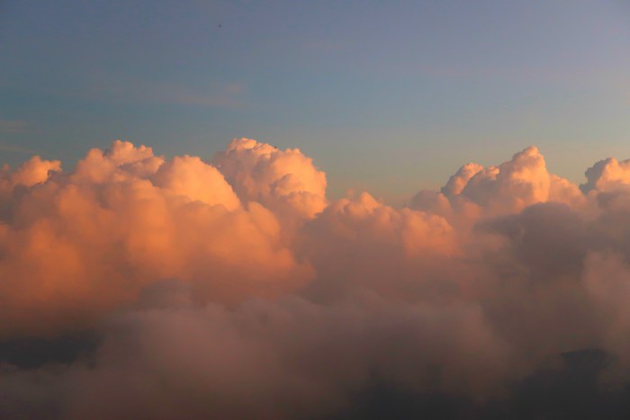 pink cotton candy clouds as seen from the top of adams peak sri pada in sri lanka 
