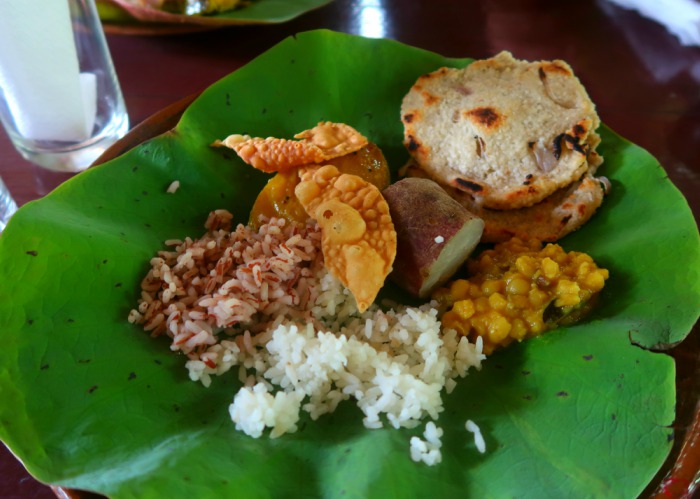 sri lankan cuisine - dhal made from lentils, sweet potatoe, rice and chips served on a banana leaf 