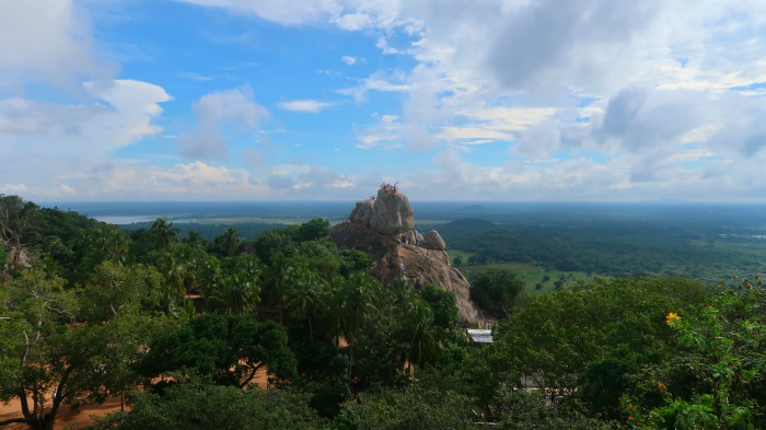 temples and sacred sites of sri lanka - Mihintale mountain, lush green jungle and blue sky in sri lanka 