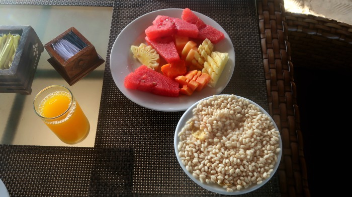 healthy breakfast with tropical fruit and orange juice in gili trawangan indonesia 