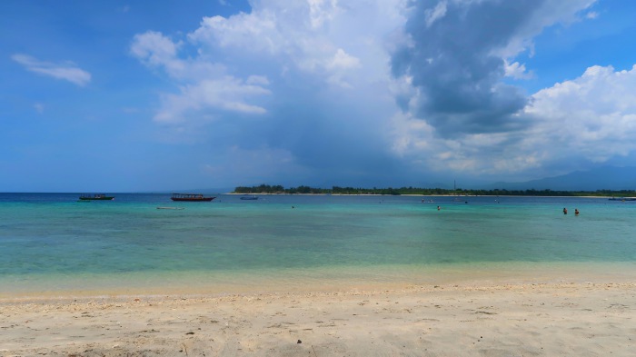 sandy beach and a stormy sky in gili trawangan indonesia