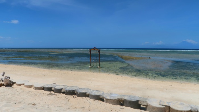 a swing in the middle of the sea in gili trawangan indonesia