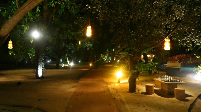 garden and lampions at night in vila ombak in gili trawangan indonesia 
