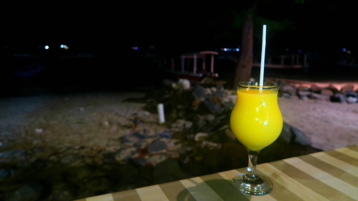yellow pineapple and mango juice on the table at night in gili trawangan indonesia 