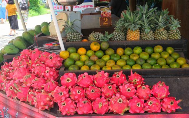 Colourful exotic fruit mangoes, dragon fruits, pineapples and oranges - Bali, Indoensia
