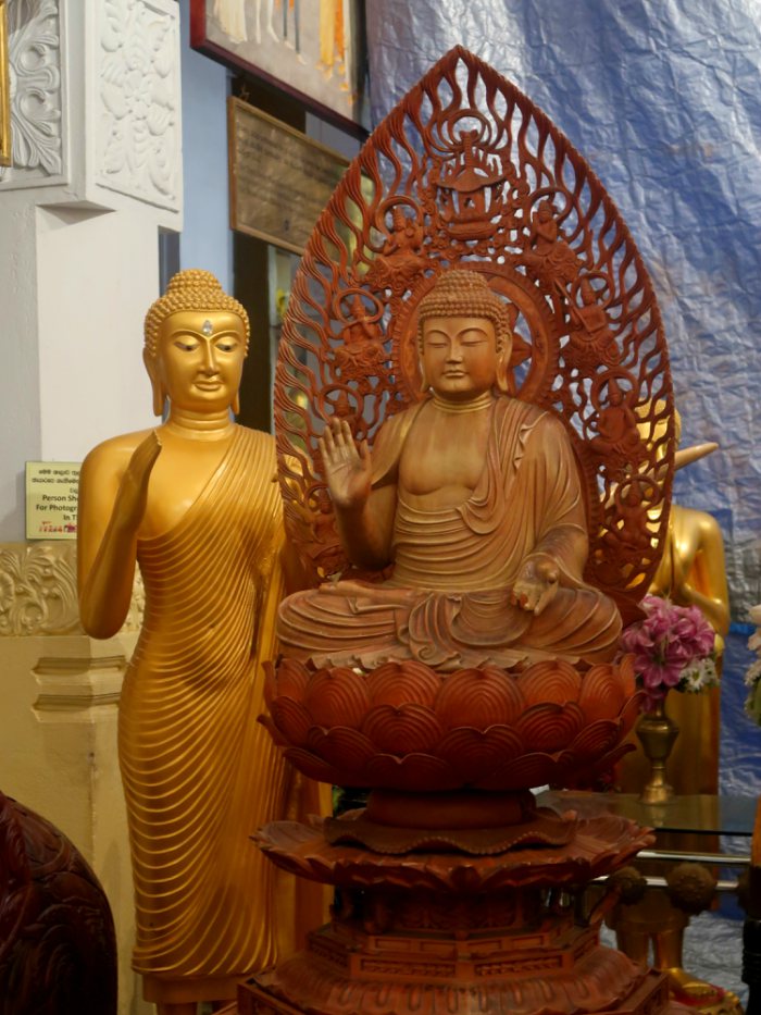 buddha statues inside of the holy tooth relic temple in kandy in sri lanka 