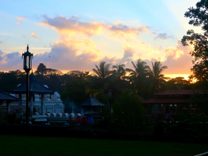 sunset in the courtyard of the holy tooth relic temple in kandy in sri lanka 