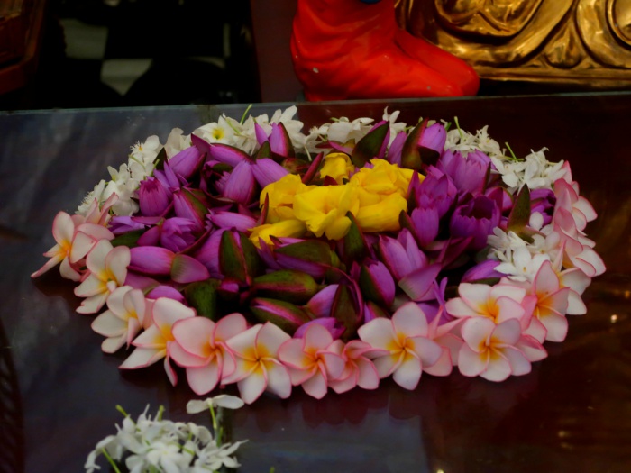 flower offerings in the holy tooth relic temple in kandy in sri lanka 